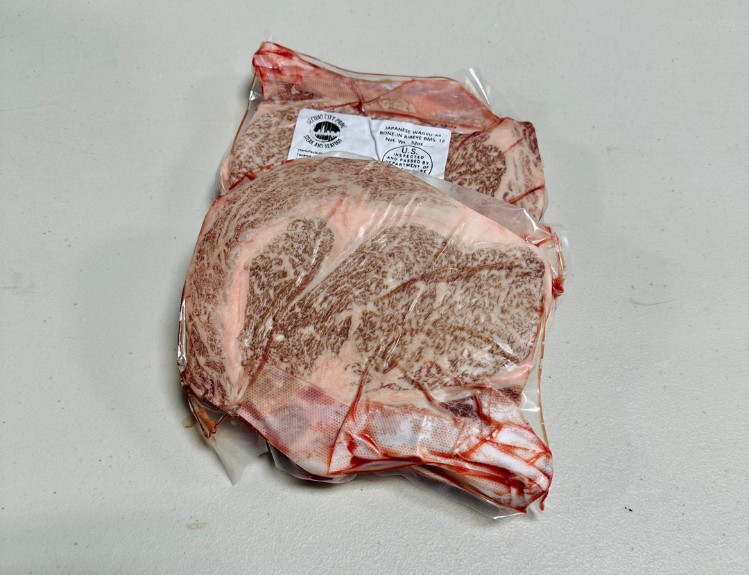 Japanese A5 Kagoshima Bone-in Ribeye steak, beautifully marbled, weighing 32oz, grade BMS 12.