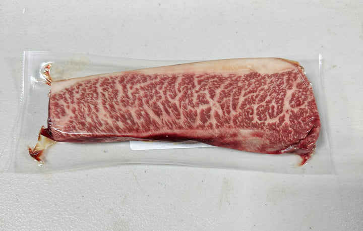 Close-up of Australian Wagyu Picanha steak with rich marbling (Marble Score 9+).