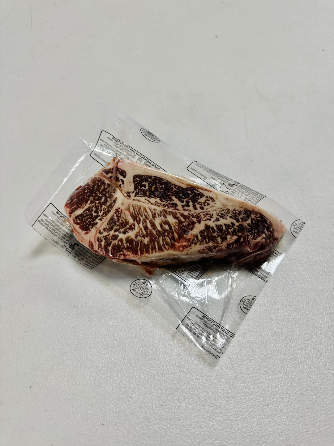 14oz Australian Wagyu New York Strip End Cut with a marble score of 9+.