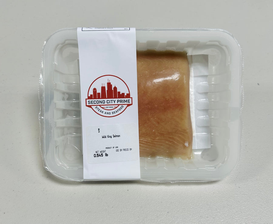 8oz Wild Ivory King Salmon portion, showcasing its creamy white flesh and skin-on cut.