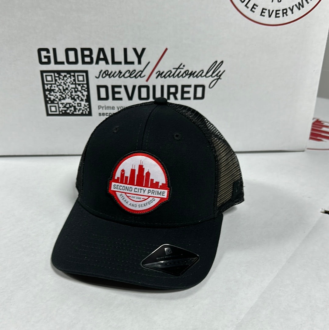 Black SCP Skyline Logo Trucker Hat, front view. Features Second City Prime logo with Chicago skyline.