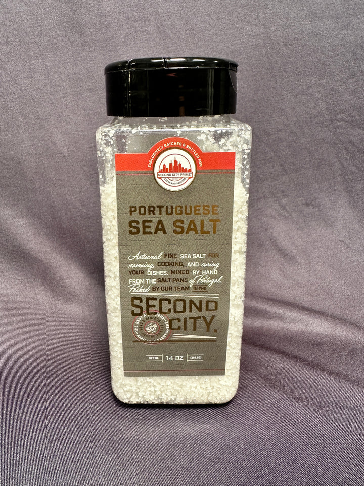 Portuguese Sea Salt (Fleur de Sel) 14oz container. A coarse, white sea salt perfect for seasoning and finishing.