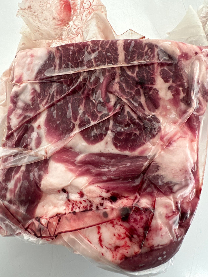 Uncooked Mangalitsa pork flat roast, ready for smoking or oven roasting.