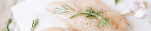 Raw Second City Prime chicken with herbs and spices.