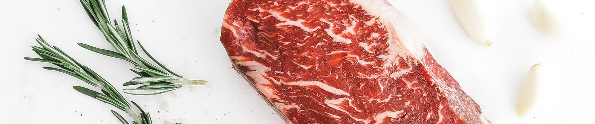Raw Second City Prime beef with herbs and garlic.