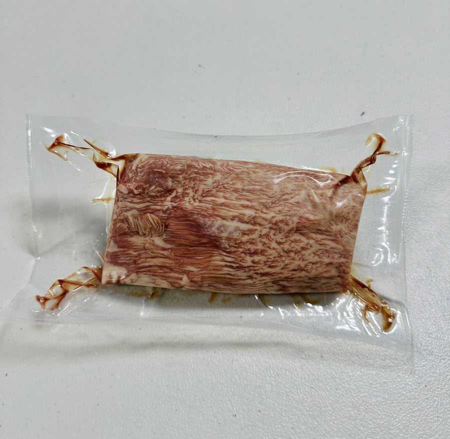 Japanese A5 Wagyu Teres Major steak, 10oz, raw and marbled.