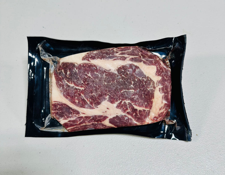 Prime Dry Aged Boneless Ribeye Steak, 8-10oz, perfectly marbled and ready to grill.