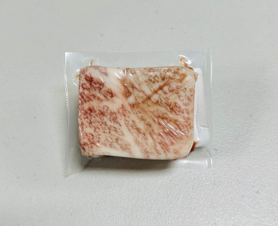 Japanese A5 Wagyu Tri Tip steak, 6oz portion, raw and marbled.