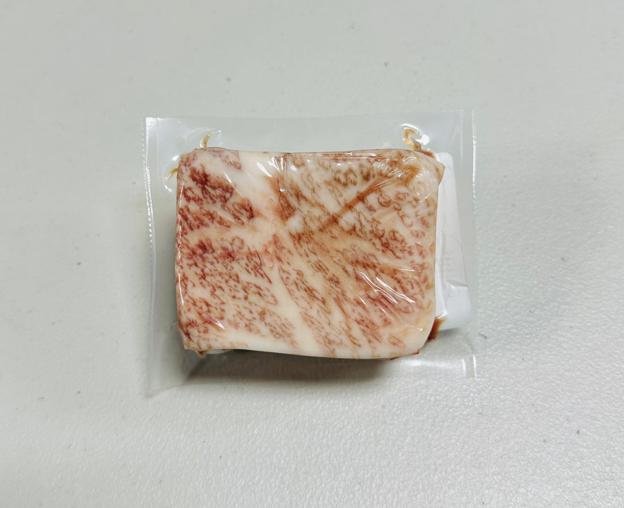 Japanese A5 Wagyu Tri Tip steak, 6oz portion, raw and marbled.