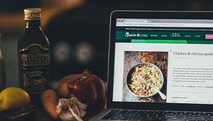 Image of cooking ingredients and tablet displaying recipe instructions.