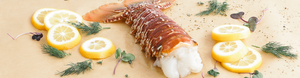 Second City Prime lobster tail with herbs and lemon slices.